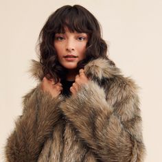 Fall Outerwear With Faux Fur Trim, Trendy Faux Fur Coat With Trim, Trendy Faux Fur Coat With Faux Fur Lining, Trendy Faux Fur Trim Coat For Fall, Trendy Faux Fur Coat With Lining, Trendy Fur Coat With Faux Fur Trim For Fall, Fall Faux Fur Outerwear With Feather Trim, Trendy Fluffy Fur Coat For Fall, Fall Faux Fur Coat With Faux Fur Trim