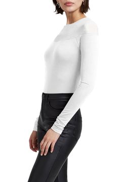 This chic long-sleeve top is made from soft and sustainable jersey and designed with a sheer yoke that easily takes your look from day to night. Crewneck Long sleeves 96% Tencel® lyocell, 4% elastane with 95% viscose, 5% elastane contrast Tencel lyocell is a sustainably produced fiber made with closed-loop processing Machine wash, line dry Imported Chic Long Sleeve Mesh Top For Layering, Fitted Long Sleeve Mesh Top For Fall, Long Sleeve Stretch Mesh Top For Fall, Fitted Long Sleeve Top With Mesh Sleeves, White Long Sleeve Tops With Sheer Sleeves, Stretch Mesh Top Long Sleeve For Fall, Stretch Long Sleeve Mesh Top For Fall, Spring Solid Tops With Sheer Sleeves, Stretch Mesh Top With Long Sleeves For Fall