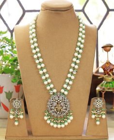 Temple Jewelry necklace of Pearl and Beads with matching earrings Perfect for any kind of occasions and ceremonies. You can wear it with Saree lehenga and Evening Gowns. Highest quality and craftsmanship. Arrives in box Please let me know if you have any questions Temple Jewelry Pearl Drop Necklace For Weddings, Festive White Jewelry With Silver Beads, Green Pearl Jewelry For Wedding, Silver Beaded Necklace For Wedding, Wedding Kundan Necklace With Pearl Drop, Silver Necklace With Matching Earrings For Reception, White Temple Jewelry Bridal Necklace With Round Beads, White Beaded Temple Jewelry Bridal Necklace, White Necklaces With Matching Earrings For Wedding