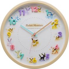 a clock with the words pocket monsters written on it's face and colorful animals around it