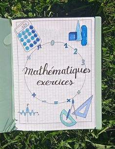 a notebook with the words mathematiques exercises written on it sitting in some grass