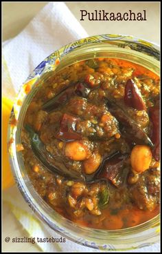 a glass jar filled with food sitting on top of a table