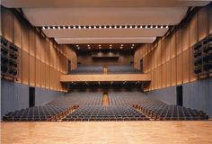 an empty auditorium with rows of seats