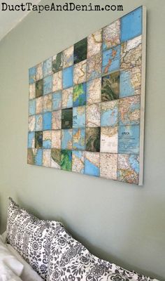 a map mounted on the wall above a bed