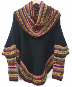 Superfine Alpaca turtleneck poncho, made of the finest alpaca. Sweater alpaca soft and warm, this is a versatile garment, ideal for cold winter seasons. It displays a casual design with andean designs and colors bright. -Goes with just about everything.-Get complimented every time you wear it.-With ethnic figures design on the top.-Unique and stylish.Material: Alpaca Wool. Alpaca Wool is hypoallergenic, light and warm. Its fibers contain microscopic air bags that make the garments light and deli Black Alpaca Poncho For Winter, Multicolor Bohemian Wool Poncho, Black Alpaca Cape For Winter, Black Alpaca Shawl For Winter, Black Alpaca Shawl Poncho, Knitted Alpaca Shawl, Winter Alpaca Poncho Cape, Winter Alpaca Cape Poncho, Bohemian Knitted Winter Cape