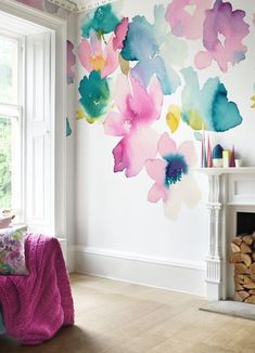 a living room filled with furniture and a painting on the wall above it's fireplace