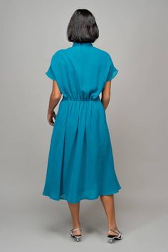 Blue plain half sleeves midi wrap dress with an asymmetrical drape at the waist and a flared out bias cut hemline. - Aza Fashions Collar Wrap Dress, Midi Wrap Dress, Studio Blue, Leh, Dress For Women, Dress Pattern, Aza Fashion, Half Sleeves, Wrap Dress