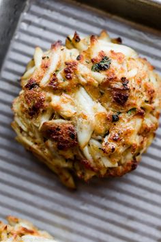 some kind of food that is sitting on a baking sheet in the oven and ready to be eaten