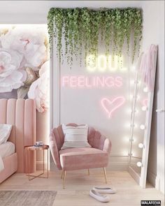 a pink chair sitting in front of a white wall with flowers and lights on it