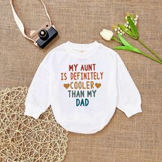 My Aunt is Definitely Cooler Than my Dad , Retro Aunt baby, Aunt Gift Romper, Aunt Funny Romper Sweatshirt, Baby Shower Gift - Handmade  - Ships from USA  - Materials: 100% CPSIA Compliant and Ethically Made material Light fabric (5.0 oz/yd² (170 g/m  Crafted with soft, breathable fabric, this romper ensures your baby stays comfortable through playtimes and nap times alike. Featuring charming designs suitable for all babies, our romper is as adorable as it is practical.  Quick Sizing Tip  Our ro Diy Gifts For Nephew, White Long Sleeve T-shirt With Funny Text, Cute Letter Print Top For First Birthday, White Long Sleeve Tops With Funny Text, White Tops With Name Print For Playtime, Cute Long Sleeve Tops With Funny Text, Graphic Print Long Sleeve Top For First Birthday, White Tops With Funny Parenting Text, White Cotton Top For First Birthday