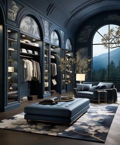 an elegant walk - in closet with blue walls and floor to ceiling glass windows overlooking the mountains