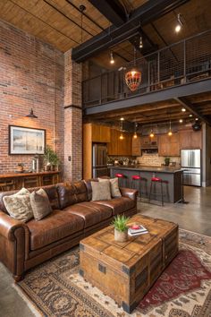 a living room filled with furniture next to a kitchen and loft style home bar area