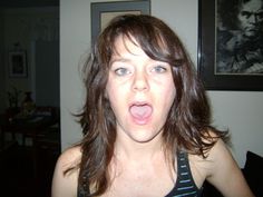 a woman making a funny face with her tongue out