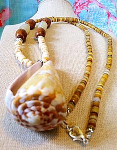 Florida Cone seashell necklace, festival hippie beach tribal boho jewelry, shell jewelry, nautical n Coconut Earrings, Ocean Ideas, Seashell Projects, Nautical Necklace, Cone Shell, Starfish Bracelet, Gold Lips, Surfer Necklace, Williamsburg Va