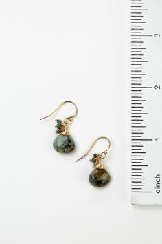 The perfect dangle earrings for the Tranquil Gardens Collection. This artisan design rests at approximately 1" from gold filled ear wires. Matte Gold Plated Brass (nickel and lead-safe) African Turquoise 1", with gold filled ear wires We hand select our natural materials, thus there may be slight variations in color and/or size that will not detract from the overall aesthetic Our unique handcrafted designer jewelry for women is made in America, each design created individually in our personal de Artisan Teardrop Earrings With Lever Back Ear Wires, Artisan Drop Earrings With Lever Back Ear Wires, Turquoise Dangle Jewelry With French Hook, Turquoise Jewelry With French Hook For Gift, Floyd Va, Silver Gold Earrings, Silver Gold Necklace, Simple Collage, American Gifts