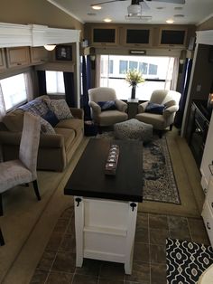 a living room filled with furniture and a flat screen tv