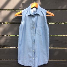 Gap Chambray Button Down Sleeveless Collar Shirt. 100% Cotton, Airy Fabric. New Without Tags In Perfect Condition. Pit To Pit 18" Length Front 25" Cotton Button-up Vest With Buttons, Cotton Button-up Vest Top, Casual Cotton Tank Top With Button Closure, Casual Cotton Tank Top With Buttons, Casual Denim Sleeveless Vest With Snap Buttons, Casual Sleeveless Blouse For Work, Gap Sleeveless Tops For Everyday Wear, Sleeveless Everyday Tops By Gap, Sleeveless Gap Tops For Everyday