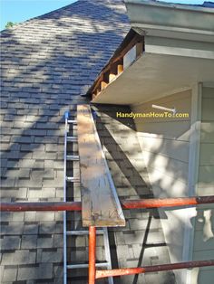 a ladder is attached to the roof of a house