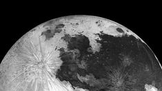 an image of the moon taken in black and white, with stars on it's side