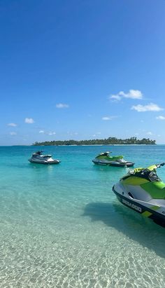 several jet skis in the clear blue water