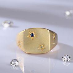 This chunky ring is such a special piece. The star symbols were so popular during the 60's and 70's and we love them just as much today. This signet ring is a perfect example of timeless design. Decorative star settings and the pretty shoulder detail add a charming antique finishing touch.Carat Weight: 0.069 ctStone Shape: RoundStone Size: 1.2,1.2,1.7 mmStone Type: Jeulia® StoneNumber of Stones: 4 Stone Color: Diamond White, Peridot Green, Sapphire BlueWeight: 5.3 gWidth: 3.2 mmHeight: 3.3 mmThi Vintage Star-shaped Anniversary Rings, Vintage Star-shaped Rings For Gift, Vintage Star Shaped Rings For Gifts, Star Shaped Signet Ring With Polished Finish, Star-shaped Polished Finish Signet Ring For Anniversary, Star-shaped Signet Ring With Polished Finish For Anniversary, Star-shaped Polished Signet Ring For Anniversary, Star Shaped Signet Ring With Polished Finish For Anniversary, Classic Star-shaped Signet Ring With Polished Finish