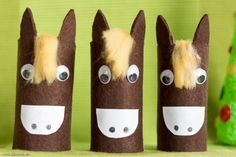 three horse made out of toilet paper rolls with googly eyes and hair on them