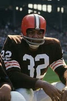 a football player is sitting on the field