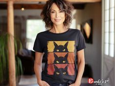 Embrace the charm of grumpy cats with this delightful and funny Cat Lover, Grumpy Black Kitten, Cat Mom, Cat Dad T-Shirt, perfect for all feline enthusiasts. A unique gift for cat moms and dads for any occasion. This eye-catching design features a black cat on a beige shaded background, adding a pop of color to your style. Available for toddlers, kids, and adults, this t-shirt comes in a variety of sizes to suit everyone in the family. Get ready for Halloween with the matching hoodie, featuring Funny Black Top With Cat Design, Funny Black Cat Design Top, Funny Black T-shirt With Cat Design, Black Short Sleeve Top With Cat Design, Kitten Black, Cat Mom Shirt, Cat Mom Shirts, Black Kitten, Cat Tee