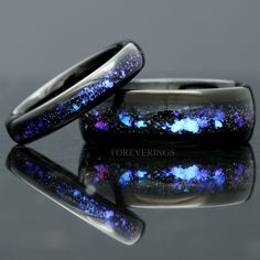 ►Material: Tungsten Carbide and Crushed Sandstone Inlay ►Color: Black Tungsten and Nebula Inspired Inlay ►Comfort Fit ►His Band Width: 8mm ►Her Band Width: 4mm ►Fit is true to size for His and Her bands ►This ring is inspired by the beautiful Orion nebula shown above. The color shifting blue-purple sandstone resemble gases of the nebula amongst a sea of stars. A beautiful alternative for a wedding band, this ring will stand out amongst the crowd of standard wedding bands. ►Sandstone is known for Titanium Wedding Rings With Polished Finish, Wedding Titanium Rings With Polished Finish, Celestial Wedding Rings With Polished Finish, Space Rings, Couples Ring, Gothic Wedding Dress, Orion Nebula, Black Tungsten Rings, Tungsten Wedding Band