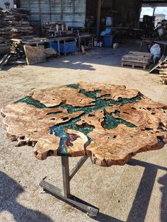 a table made out of wood and metal legs