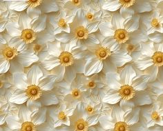 a bunch of white flowers with yellow centers on the petals are arranged in a pattern