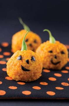 three pumpkins with faces made out of rice krispy treats