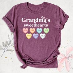 "Grandma's Sweethearts Shirt, Valentines Day Grandma Tshirt with Grandkids Names, Mothers Day Shirt, Custom Grandma Tee, Nana Mimi Gigi Shirt, Valentine Grandma, Grandmother Shirt, Cute Grandma Shirt, New Nana Shirt, Granny Shirt, Mimi Birthday Shirt. Hello, Thanks for your support. Your gladness comes first and all work is done with LOVE in here. Always keep your support please:)   Grandma's Sweethearts  shirts are branded Bella+Canvas.  Personalized Grandparents Shirt Contents: - Solid colors: Sweet Cotton T-shirt For Gifts, Sweet Cotton T-shirt As Gift, Sweet Letter Print T-shirt For Birthday, Sweet Graphic Print Birthday T-shirt, Sweet Graphic Print T-shirt For Birthday, Cute Multicolor Heart-shaped Tops, Cute T-shirt With Name Print For Gift, Sweet Cotton Tops As Gift, Mother's Day Heart-shaped T-shirt With Letter Print