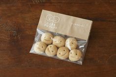 small cookies in a bag on a wooden table