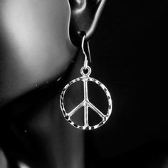 "Matching pendants Click below https://www.etsy.com/listing/1270343938/silver-peace-pendant-925-sterling 925 Sterling Silver peace sign earrings with choice of two types of Diamond cut details. Product Type: 925 Sterling Silver Dangle Wire Earrings Product Dimension: Earring height 1 1/2\" with ear wire Earring height without ear wire 7/8\" Product Dimension: Earring width 7/8\" Product Fastening: 925 Sterling Silver ear wire hook Product Materials: 925 Sterling Silver Product Hallmark: 925 stam Types Of Diamond Cuts, Wire Earrings, Ear Wire, Peace Sign, Peace And Love, Diamond Cuts, Silver Necklace, Dangle Drop Earrings, Gifts For Her