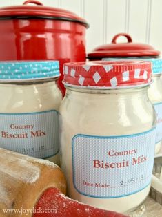 three jars filled with different types of bread