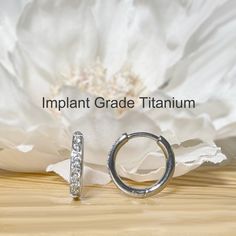 ✦ Sold as Pair ✦ [SPECS] - Material: Implant Grade Titanium - Hoop Width: 2mm - Stone: High Quality Cubic Zirconia (CZ) - Available colors: Silver, Gold - Inner Diameter: 8mm, 10mm - Thickness available: 18ga - Plating: PVD over Implant Grade Titanium --- SHIPPING INFORMATION --- *Our Current turnaround time is 1-2 business days before your order ships. *All orders will be shipped USPS and can take anywhere from 2-7 days to reach you (NOT Guaranteed). *If you need guaranteed delivery, please sel Heavy Sweating, Titanium Earrings, Photo Proof, Jewelry Earrings Hoops, Mild Soap, Jewelry Plate, Body Jewelry, Hinges, Silver Gold