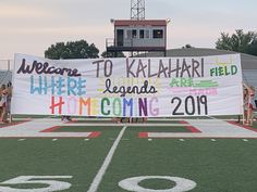 there is a sign on the field that says welcome to kaalahari field