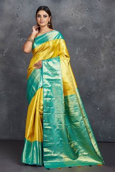 Buy beautiful yellow Kanjeevaram saree online in USA with blue zari border. Keep your ethnic wardrobe up to date with latest designer sarees, pure silk sarees, Kanchipuram silk sarees, handwoven sarees, tussar silk sarees, embroidered sarees from Pure Elegance Indian saree store in USA.-full view Yellow Handloom Pre-draped Saree For Wedding, Yellow Tussar Silk Pre-draped Saree For Diwali, Yellow Katan Silk Pre-draped Saree, Festive Yellow Paithani Silk Pre-draped Saree, Yellow Paithani Silk Anarkali Pre-draped Saree, Gold Paithani Silk Pre-draped Saree, Yellow Art Silk Pre-draped Saree In Traditional Drape, Yellow Anarkali Style Pre-draped Art Silk Saree, Yellow Raw Silk Pre-draped Saree With Pallu