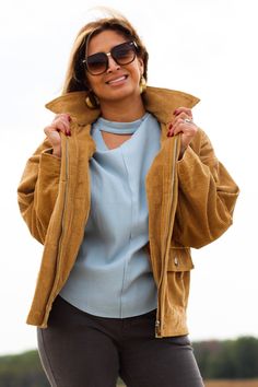 Complete any look with this stylish and comfortable jacket! -Color: Camel -Removable faux fur collared -Button down/ Zip up -Side flap pockets -Oversized silhouette -Content: 100% Cotton -Imported -Model is 5'5" 36-30-40 and wearing a size Small Spring Workwear Outerwear With Corduroy Collar, Trendy Winter Outerwear With Flap Pockets, Trendy Outerwear With Flap Pockets For Winter, Fall Corduroy Utility Jacket With Corduroy Collar, Winter Utility Jacket With Corduroy Collar, Winter Utility Jacket With Corduroy Collar And Button-up, Winter Utility Jacket With Corduroy Collar Button-up, Beige Winter Outerwear With Corduroy Collar, Beige Corduroy Outerwear For Work