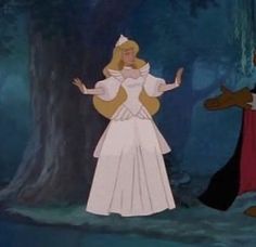 the princess and the frog are standing next to each other in front of a tree