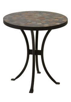 a round table with black metal legs and a mosaic design on the top, against a white background