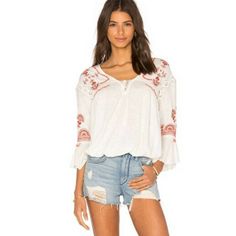 Free People Chiquita Ivory Embroidered Combo Peasant Top Small Brand: Free People Size: Small Size Type: Relaxed Style: Chiquita Embroidered Type: Peasant Top Color: White Red Black Neckline: V Neck Material: 100% Cotton Pattern: Embroidered Trim Sleeve Length: Flutter Bell Sleeve Features: Lightweight, Boho Closure: Front Lace-Up Tie Condition: Pre-Owned, In Good Condition. *Some Few Loose Thread Barely Noticeable Measurement: Chest Size: 20” Length: 22” - We Sell Nwt / Pre Owned, Clean No Flaw White Bohemian Tops With Floral Embroidery, White Bohemian Peasant Top With Chikankari Embroidery, Embroidered Off White Summer Tops, Off White Embroidered Summer Tops, White Folk Style Peasant Top For Vacation, White Folk Peasant Top For Vacation, White Chikankari Embroidery Peasant Top, White Bohemian Blouse With Chikankari Embroidery, White Peasant Top With Chikankari Embroidery For Summer