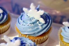 cupcakes with blue frosting and snowflakes on them