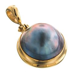 1 1/8" Pacific Blue Mabe Pearl 24k Gold Vermeil 925 Sterling Silver PendantHandcrafted pendant in 24K gold plated 925 sterling silver, otherwise known as vermeil. The workmanship is evident in the finesse of the settings and bright polish. You will be pleased by the quality of our manufacturing and materials.Bail Size:  ~5mmPendant Material:  24K on 925 sterling silverPendant Size:  30mm(1 1/8")w/bailPendant Weight:  ~6 gramsPearl Size:  15mmPearl Type:  Blue Mabe Pearl Gold Domed Jewelry Gift, Gold Domed Gemstone Jewelry, Gold Round Pendant Jewelry With High Luster, Mabe Pearl, Right Hand Rings, Pacific Blue, Pearl Types, Mother Pearl, Pearl Size