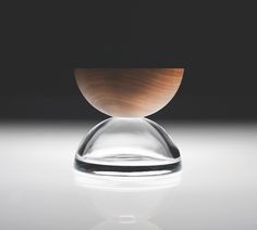 a wooden bowl sitting on top of a table