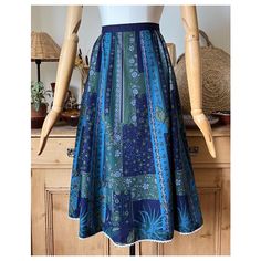 Floral and butterfly patterned striped vintage traditional Austrian folk skirt in blue and green color. Measurements: laid flat on one side Length: 73 cm / 28,7" Waist: 40 cm / 15,7" Brand: Heller Tracht Material: cotton with acetate lining  Size (I think best for): EU 38, US 8, UK 10 Please check the measurements! Retro Long Blue Skirt, Vintage Green Long Skirt, Vintage Long Green Skirt, Vintage Blue Full Skirt, Green Vintage Long Skirt, Blue Lined Vintage Skirt, Vintage Blue Lined Skirt, Traditional Blue Lined Skirt, Traditional Blue Flowy Skirt