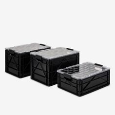 three black plastic storage containers sitting side by side