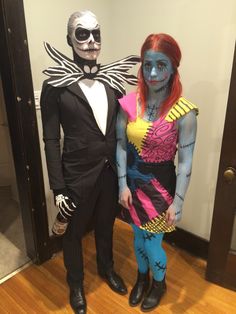 two people dressed up in costumes standing next to each other