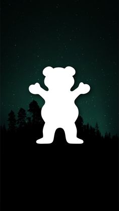 the silhouette of a teddy bear against a night sky with stars and trees in the background